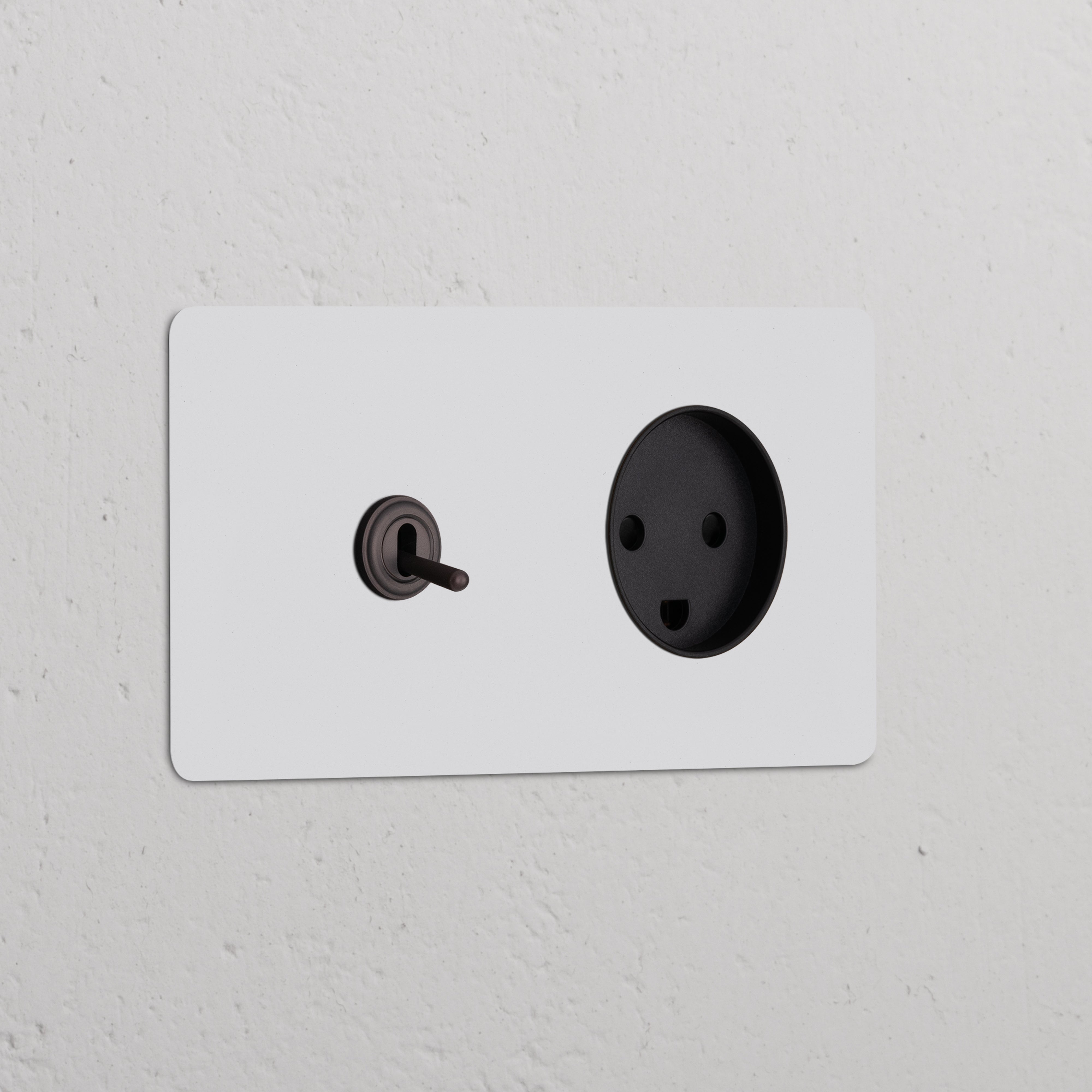 Double toggle switch and Danish Type K power module in paintable bronze black finish for double sockets & modules.