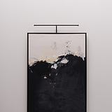 Harrow Picture Light 580mm - Bronze illuminating an artwork on the wall with its elegant design.