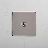 Intermediate Light Toggle Switch on White Background: Polished Nickel Single Toggle Switch (Int)