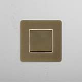 Versatile Intermediate Rocker Switch in Antique Brass White for Controlled Lighting on White Background