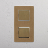 Vertical Double Rocker Switch in Antique Brass White, Two Positions on White Background