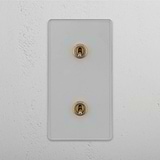 Stylish Double Vertical Toggle Switch in Clear Antique Brass on White Background