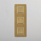 Easy-to-Control Vertical Triple Rocker Switch in Antique Brass White on White Background