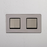 High Capacity Quad Control Light Switch: Four-Way Rocker Switch in Polished Nickel Black on White Background