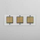 Six-Position Triple Rocker Switch in Clear Antique Brass Black - Comprehensive Lighting Accessory on White Background
