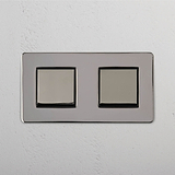 Dual Control Light Switch: Double Rocker Switch in Polished Nickel Black on White Background