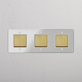 Advanced Light Control System: Triple Rocker Switch in Clear Antique Brass White on White Background