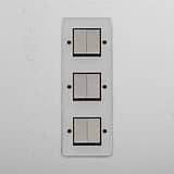 Advanced Vertical Six-Position Triple Rocker Switch in Clear Polished Nickel Black - Multifunctional Light Management Tool on White Background