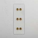 Six-Levers Vertical Triple Toggle Switch in Clear Antique Brass - Stylish Lighting Accessory on White Background