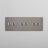 Super Capacity Light Toggle Switch: Polished Nickel Triple 6x Toggle Switch on White Background