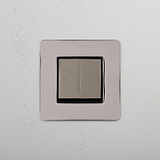 Dual Control Light Switch on White Background: Polished Nickel Black Single 2x Rocker Switch