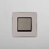 Dual Control Light Switch on White Background: Polished Nickel Black Single 2x Rocker Switch