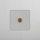 Central Position Single Toggle Switch in Clear Antique Brass - Efficient Light Management on White Background