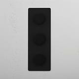 Adjustable Light Control with Vertical Bronze Triple Dimmer Switch on White Background