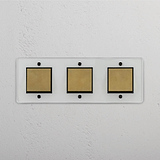 Triple Rocker Switch in Clear Antique Brass Black - Stylish Light Control Solution on White Background