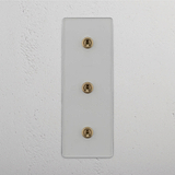 Vertical Triple Toggle Switch in Clear Antique Brass - Efficient Light Management Tool on White Background