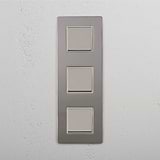 Vertical Triple Rocker Switch in Polished Nickel White on White Background