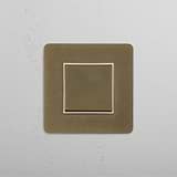 Modern Design Single Rocker Switch in Antique Brass White on White Background