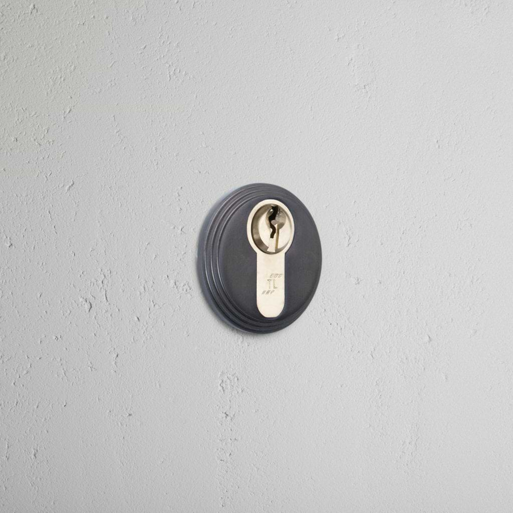 Bronze Warwick Key Escutcheon on White Background