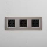 High Capacity Schuko Standard Power Outlet: Polished Nickel Black Triple 3x Schuko Module on White Background