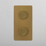 Vertical Double Dimmer Switch, Antique Brass Aesthetic on White Background