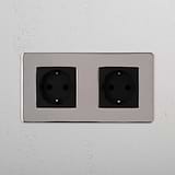 Dual Power Outlet for Schuko Standard: Double Schuko Power Module in Polished Nickel Black on White Background