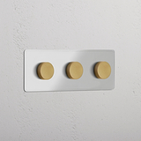 Plaque triple avec trois variateurs multidirectionnels Laiton Ancien Transparent, pour interrupteurs muraux.