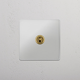 Central Position Single Toggle Switch in Clear Antique Brass - Efficient Light Management on White Background