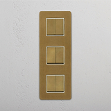 Versatile Triple Vertical Rocker Switch in Antique Brass White for Easy Operation on White Background