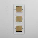 Six-Position Vertical Triple Rocker Switch in Clear Antique Brass Black - Advanced Light Control Accessory on White Background