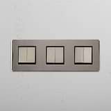Super Capacity Light Control Switch: Polished Nickel Black Triple 6x Rocker Switch on White Background