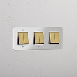 Six-Position Triple Rocker Switch in Clear Antique Brass White - Comprehensive Light Management Accessory
