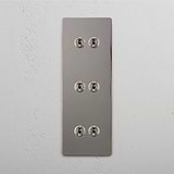 Super Capacity Vertical Light Toggle Switch: Polished Nickel Triple 6x Vertical Toggle Switch on White Background
