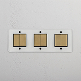 Six-Position Triple Rocker Switch in Clear Antique Brass Black - Comprehensive Lighting Accessory on White Background