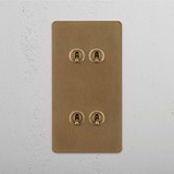 Vertical Design Double Toggle Switch, Four-Switch, Antique Brass on White Background