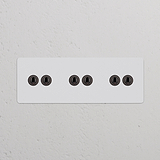 Interruptor articulado de seis vias triplo – Bronze Pintável para controle eficiente de funções elétricas.