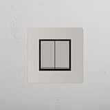 Interrutor de luz de controlo duplo em fundo branco: Interruptor basculante 2x individual Níquel Polido Preto