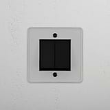 Interruptor basculante duplo em Bronze Transparente Preto - Solução de controlo de luz elegante em fundo branco