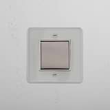Interruptor basculante individual central em Níquel Polido Transparente Branco - Acessório de iluminação versátil em fundo branco