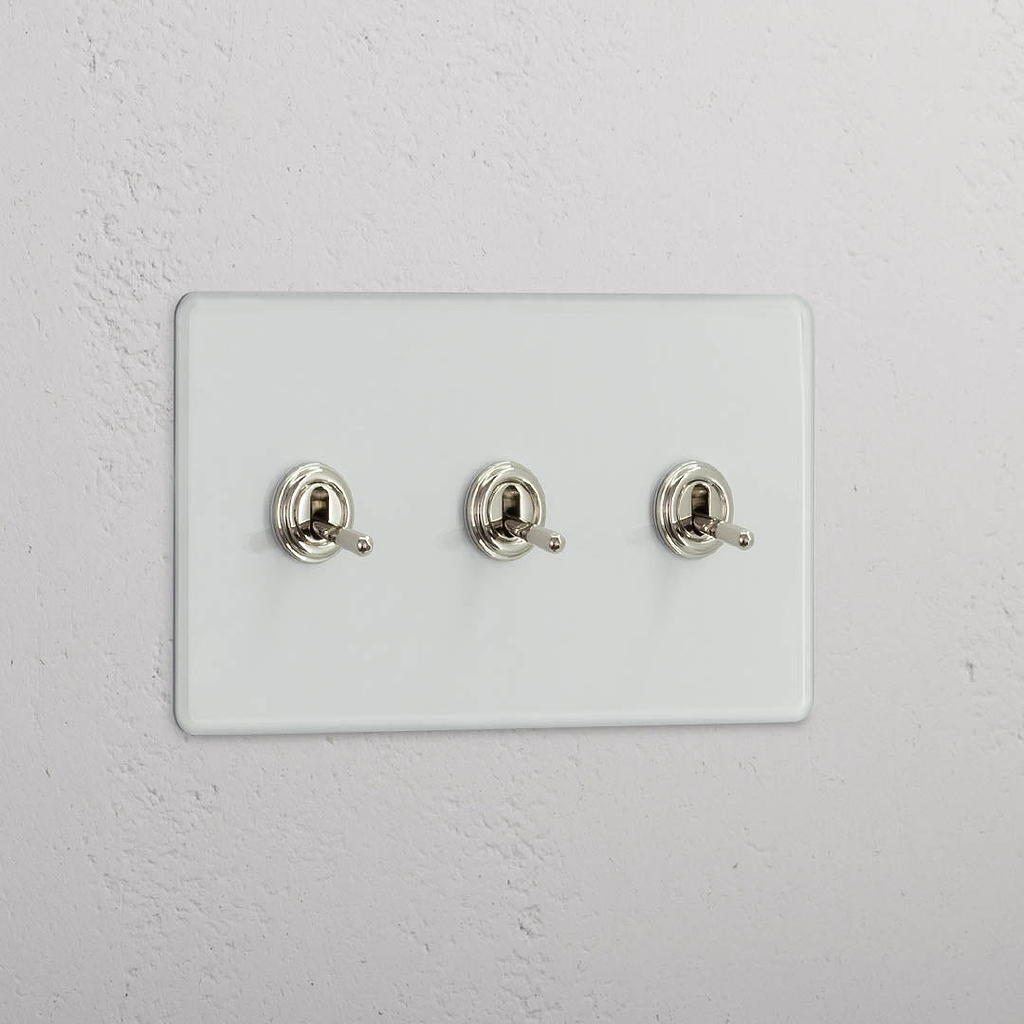 Interruptor articulado triplo em Níquel Polido Transparente - Acessório de controlo de luz funcional