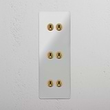 Interruptor articulado triplo vertical de seis botões em Latão Antigo Transparente - Elegante acessório de iluminação em fundo branco