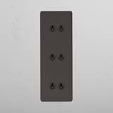 Elegante interruptor articulado triplo vertical Bronze com 6 posições em fundo branco