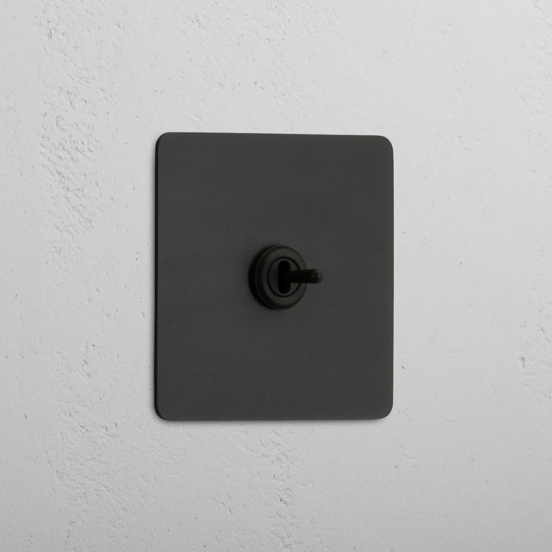 Interruptor articulado individual central Bronze - elegante solução de controlo de luz