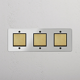Interruptor basculante triplo em Latão Antigo Preto Transparente - Solução de controlo de luz elegante em fundo branco