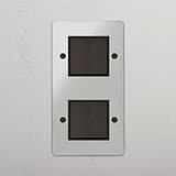 Interruptor basculante duplo vertical em Bronze Transparente Preto - Ferramenta de gestão de luz funcional em fundo branco