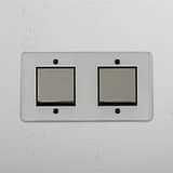 Sofisticado interruptor basculante duplo em Níquel Polido Transparente Preto para controlo de iluminação em fundo branco