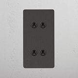 Interruptor articulado duplo vertical em Bronze com 4 botões em fundo branco