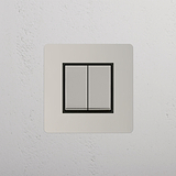 Interrutor de luz de controlo duplo em fundo branco: Interruptor basculante 2x individual Níquel Polido Preto