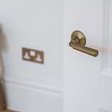 Digby Sprung Door Handle - Antique Brass