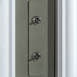 Close-up of a 2G architrave two-way toggle switch with a paintable polished nickel finish.